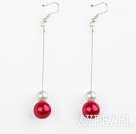 dangling white and red acrylic ball earrings