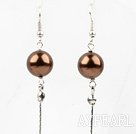 Dangle style brown round seashell earrings with long tail