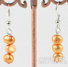 dyed orange pearl earrings